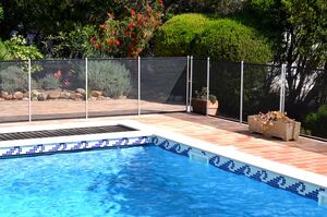Picture of a pool in Windermere surrounded by a pool safety fence.