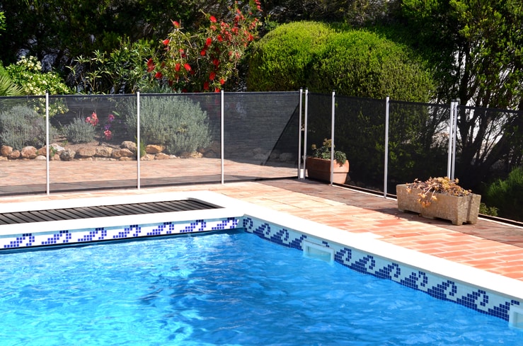 pool safety fence shown installed around a pool in orlando.